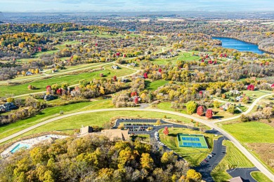 This Branigar farmhouse-style home is set on a beautiful, wooded on Eagle Ridge Inn and Resort in Illinois - for sale on GolfHomes.com, golf home, golf lot