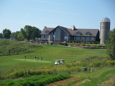 This Branigar farmhouse-style home is set on a beautiful, wooded on Eagle Ridge Inn and Resort in Illinois - for sale on GolfHomes.com, golf home, golf lot