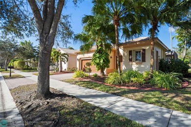 Welcome to your dream home in the serene Bay Cove in Heron Bay on Heron Bay Golf Club in Florida - for sale on GolfHomes.com, golf home, golf lot