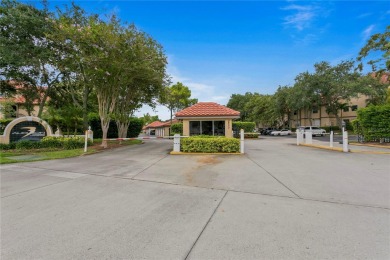 Experience serene pond views from this first-floor, corner unit on Feather Sound Country Club in Florida - for sale on GolfHomes.com, golf home, golf lot