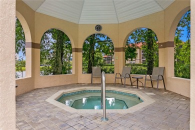 Experience serene pond views from this first-floor, corner unit on Feather Sound Country Club in Florida - for sale on GolfHomes.com, golf home, golf lot