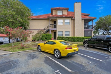 Experience serene pond views from this first-floor, corner unit on Feather Sound Country Club in Florida - for sale on GolfHomes.com, golf home, golf lot