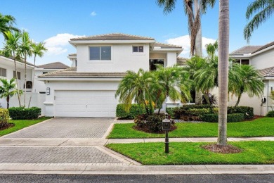 Stunning, two-story 4 BD 4 BA plus office home with lake views on Woodfield Country Club in Florida - for sale on GolfHomes.com, golf home, golf lot