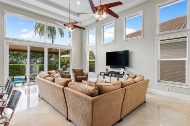 Stunning, two-story 4 BD 4 BA plus office home with lake views on Woodfield Country Club in Florida - for sale on GolfHomes.com, golf home, golf lot