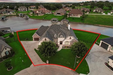 This stunning custom-built, single-story 4-bedroom, 3-bath on The Golf Club at Resort Eagle Mountain Lake in Texas - for sale on GolfHomes.com, golf home, golf lot