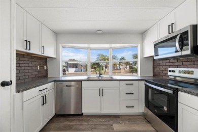 Welcome to this beautifully updated 2-bedroom, 2-bath home on Kings Gate Golf Club in Florida - for sale on GolfHomes.com, golf home, golf lot