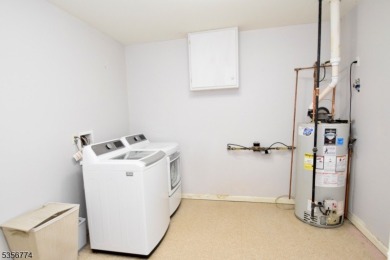 This 3-bedroom, 3-bath end-unit townhome isn't just a place to on Minerals Golf Club in New Jersey - for sale on GolfHomes.com, golf home, golf lot