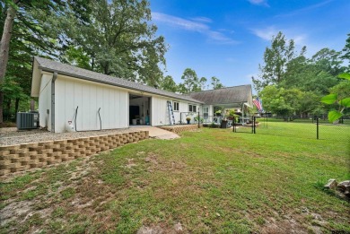 This spacious home sitting on the 16th fairway in Holly Lake on Holly Lake Ranch Golf Club in Texas - for sale on GolfHomes.com, golf home, golf lot