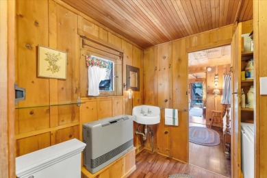 Welcome to Haleiwa! This fully furnished 1928 original Tahoe on Old Brockway Golf Club in California - for sale on GolfHomes.com, golf home, golf lot