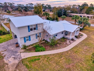 NEW PRICE + NEW METAL ROOF! Pool home just minutes from the on Saint Josephs Bay Country Club in Florida - for sale on GolfHomes.com, golf home, golf lot