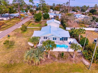 NEW PRICE + NEW METAL ROOF! Pool home just minutes from the on Saint Josephs Bay Country Club in Florida - for sale on GolfHomes.com, golf home, golf lot
