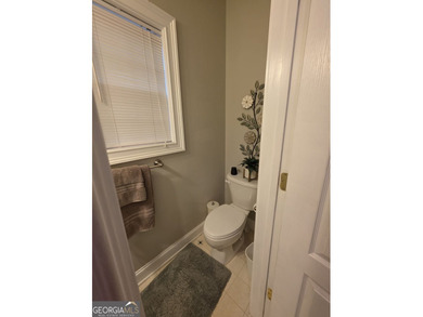 Welcome to this beautifully maintained all-brick home, ideally on Canongate At Georgia National Golf Club in Georgia - for sale on GolfHomes.com, golf home, golf lot