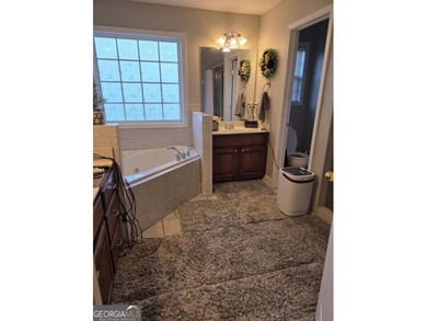 Welcome to this beautifully maintained all-brick home, ideally on Canongate At Georgia National Golf Club in Georgia - for sale on GolfHomes.com, golf home, golf lot