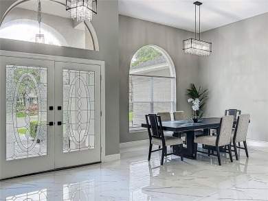 Welcome to a masterpiece of modern design and refined living in on Tuscawilla Country Club in Florida - for sale on GolfHomes.com, golf home, golf lot