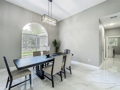 Welcome to a masterpiece of modern design and refined living in on Tuscawilla Country Club in Florida - for sale on GolfHomes.com, golf home, golf lot