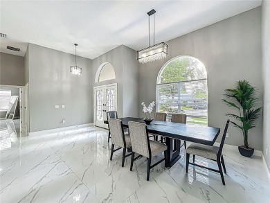Welcome to a masterpiece of modern design and refined living in on Tuscawilla Country Club in Florida - for sale on GolfHomes.com, golf home, golf lot