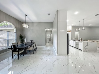 Welcome to a masterpiece of modern design and refined living in on Tuscawilla Country Club in Florida - for sale on GolfHomes.com, golf home, golf lot