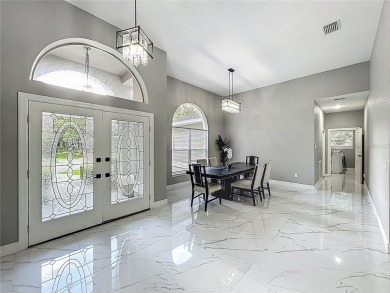 Welcome to a masterpiece of modern design and refined living in on Tuscawilla Country Club in Florida - for sale on GolfHomes.com, golf home, golf lot