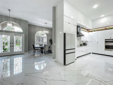 Welcome to a masterpiece of modern design and refined living in on Tuscawilla Country Club in Florida - for sale on GolfHomes.com, golf home, golf lot