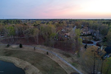 Build your dream house on this beautiful, hilly lot overlooking on Ironwood Golf and Country Club in North Carolina - for sale on GolfHomes.com, golf home, golf lot