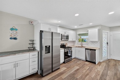 UNOBSTRUCTED GULF ACCESS. PRIVATE BEACH. CUTE AS A BUTTON on Gulf Harbors Golf Course in Florida - for sale on GolfHomes.com, golf home, golf lot