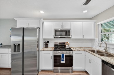 UNOBSTRUCTED GULF ACCESS. PRIVATE BEACH. CUTE AS A BUTTON on Gulf Harbors Golf Course in Florida - for sale on GolfHomes.com, golf home, golf lot