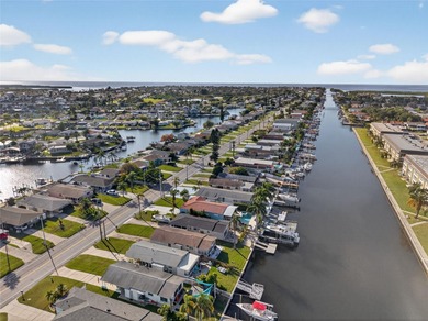 UNOBSTRUCTED GULF ACCESS. PRIVATE BEACH. CUTE AS A BUTTON on Gulf Harbors Golf Course in Florida - for sale on GolfHomes.com, golf home, golf lot