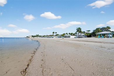 UNOBSTRUCTED GULF ACCESS. PRIVATE BEACH. CUTE AS A BUTTON on Gulf Harbors Golf Course in Florida - for sale on GolfHomes.com, golf home, golf lot