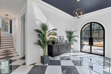 Discover unparalleled luxury at 106 Haddington Drive, a on Forest Creek Golf Club  in North Carolina - for sale on GolfHomes.com, golf home, golf lot