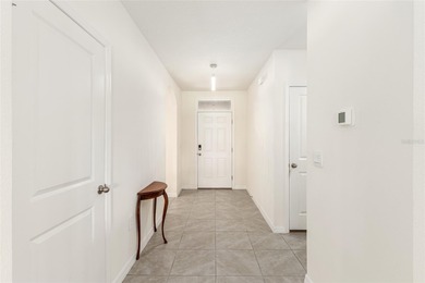 Light flows gracefully through every room of this elegant on Lake Diamond Golf and Country Club in Florida - for sale on GolfHomes.com, golf home, golf lot