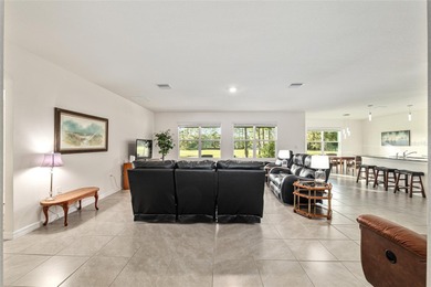 Light flows gracefully through every room of this elegant on Lake Diamond Golf and Country Club in Florida - for sale on GolfHomes.com, golf home, golf lot