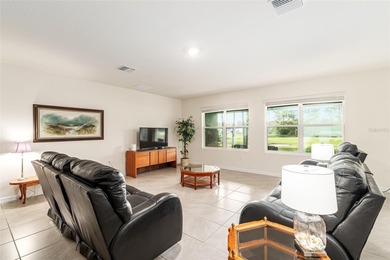 Light flows gracefully through every room of this elegant on Lake Diamond Golf and Country Club in Florida - for sale on GolfHomes.com, golf home, golf lot