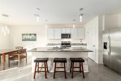 Light flows gracefully through every room of this elegant on Lake Diamond Golf and Country Club in Florida - for sale on GolfHomes.com, golf home, golf lot