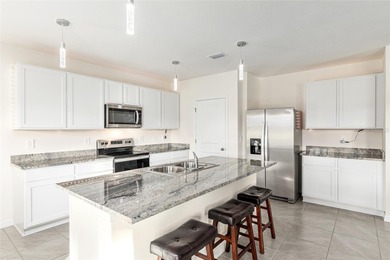 Light flows gracefully through every room of this elegant on Lake Diamond Golf and Country Club in Florida - for sale on GolfHomes.com, golf home, golf lot