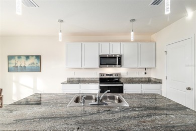 Light flows gracefully through every room of this elegant on Lake Diamond Golf and Country Club in Florida - for sale on GolfHomes.com, golf home, golf lot