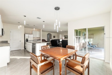 Light flows gracefully through every room of this elegant on Lake Diamond Golf and Country Club in Florida - for sale on GolfHomes.com, golf home, golf lot