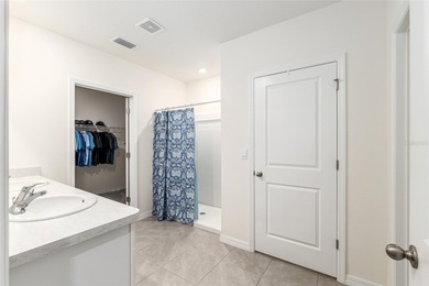 Light flows gracefully through every room of this elegant on Lake Diamond Golf and Country Club in Florida - for sale on GolfHomes.com, golf home, golf lot