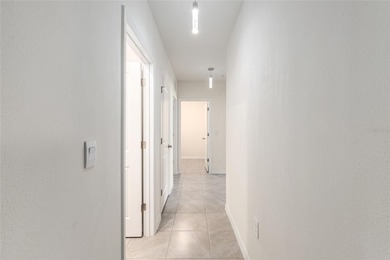 Light flows gracefully through every room of this elegant on Lake Diamond Golf and Country Club in Florida - for sale on GolfHomes.com, golf home, golf lot