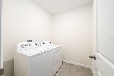 Light flows gracefully through every room of this elegant on Lake Diamond Golf and Country Club in Florida - for sale on GolfHomes.com, golf home, golf lot