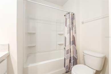 Light flows gracefully through every room of this elegant on Lake Diamond Golf and Country Club in Florida - for sale on GolfHomes.com, golf home, golf lot