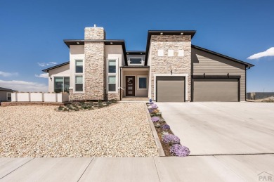 Enjoy breathtaking views of snow-capped Pikes Peak by day and on Walking Stick Golf Course in Colorado - for sale on GolfHomes.com, golf home, golf lot