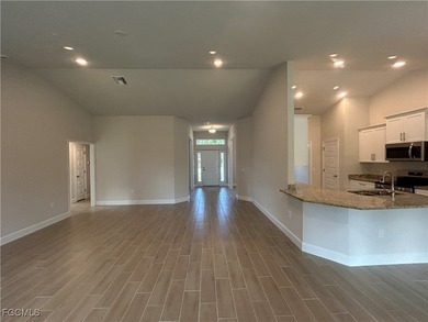 THIS BEAUTIFUL BRAND NEW ADAMS HOME IS MOVE IN READY AND WAITING on Kingsway Country Club in Florida - for sale on GolfHomes.com, golf home, golf lot