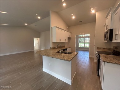 THIS BEAUTIFUL BRAND NEW ADAMS HOME IS MOVE IN READY AND WAITING on Kingsway Country Club in Florida - for sale on GolfHomes.com, golf home, golf lot