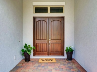 Step into luxury living in the heart of Lake Nona's prestigious on Eagle Creek Golf Club in Florida - for sale on GolfHomes.com, golf home, golf lot