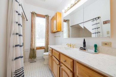 This two bedroom one and a half bath charming farm house built on Grosse Ile Golf and Country Club in Michigan - for sale on GolfHomes.com, golf home, golf lot