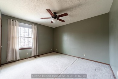 Welcome home to this beautiful 4-bedroom, 2-bath property on Indianhead Golf Club in Nebraska - for sale on GolfHomes.com, golf home, golf lot