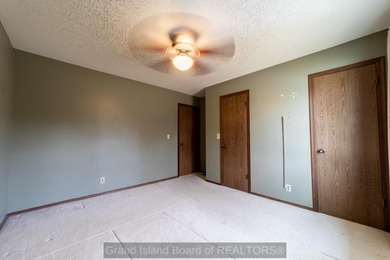 Welcome home to this beautiful 4-bedroom, 2-bath property on Indianhead Golf Club in Nebraska - for sale on GolfHomes.com, golf home, golf lot