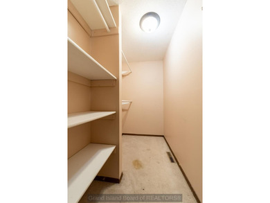 Welcome home to this beautiful 4-bedroom, 2-bath property on Indianhead Golf Club in Nebraska - for sale on GolfHomes.com, golf home, golf lot