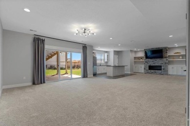 This 4-bedroom, 4-bath reverse 1.5-story is packed with upgrades on Heritage Park Golf Course in Kansas - for sale on GolfHomes.com, golf home, golf lot