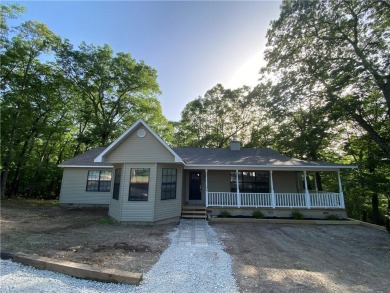 This beautifully remodeled 3BR/2BA home sits on 2 wooded lots( on Holiday Island Golf Course in Arkansas - for sale on GolfHomes.com, golf home, golf lot